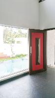 The entrance foyer.

The pool is seen through the large sheet glass window.